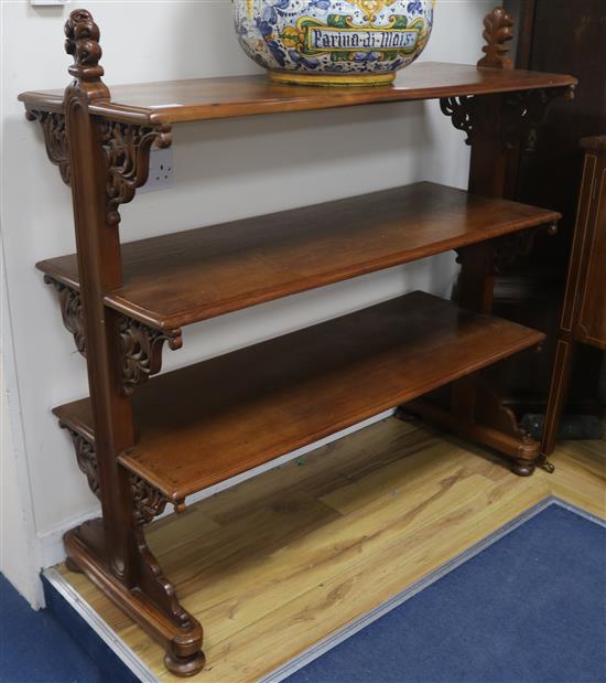 A Victorian carved walnut three-tier dumb waiter, W.122cm